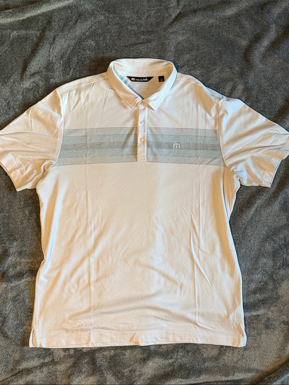 Travis Mathew White Polo with Light Gray Chest Stripes